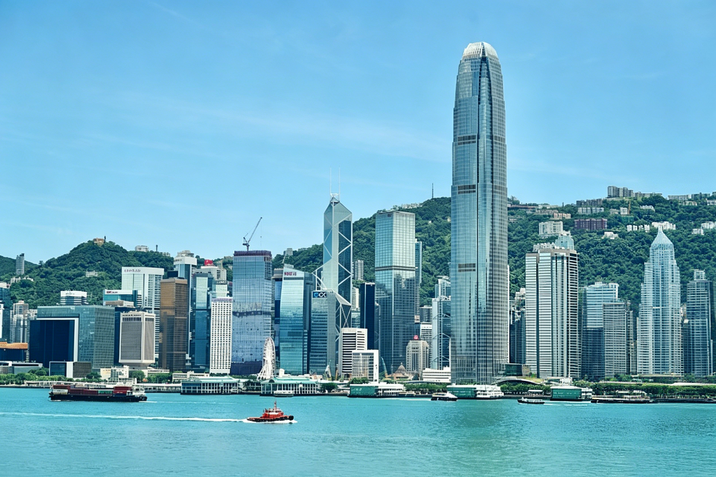 Victoria Harbour skyline at dusk — Hong Kong's iconic cityscape viewed from the Kowloon waterfront
