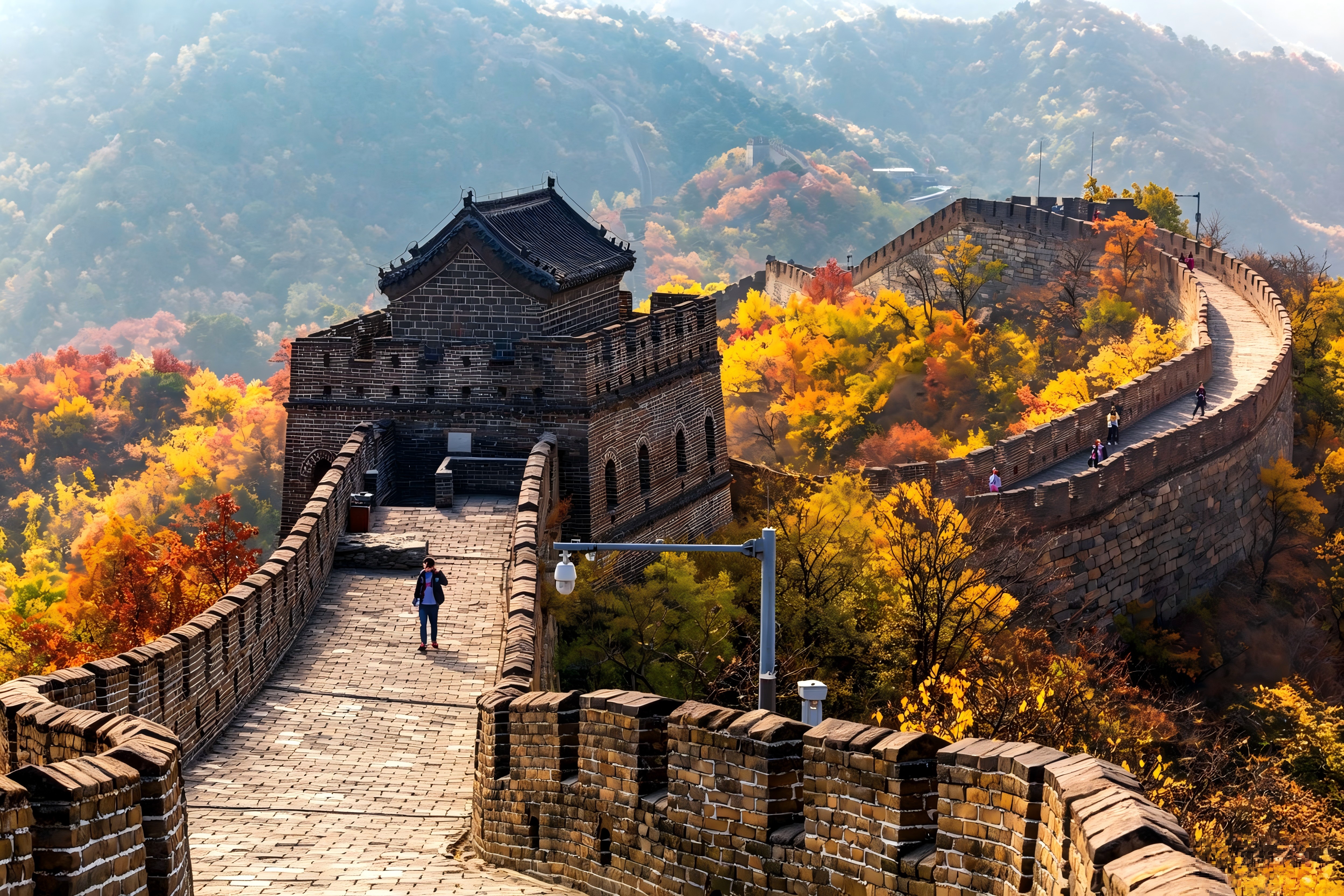 The Great Wall at Mutianyu — Ming Dynasty fortifications winding through autumn-colored mountains