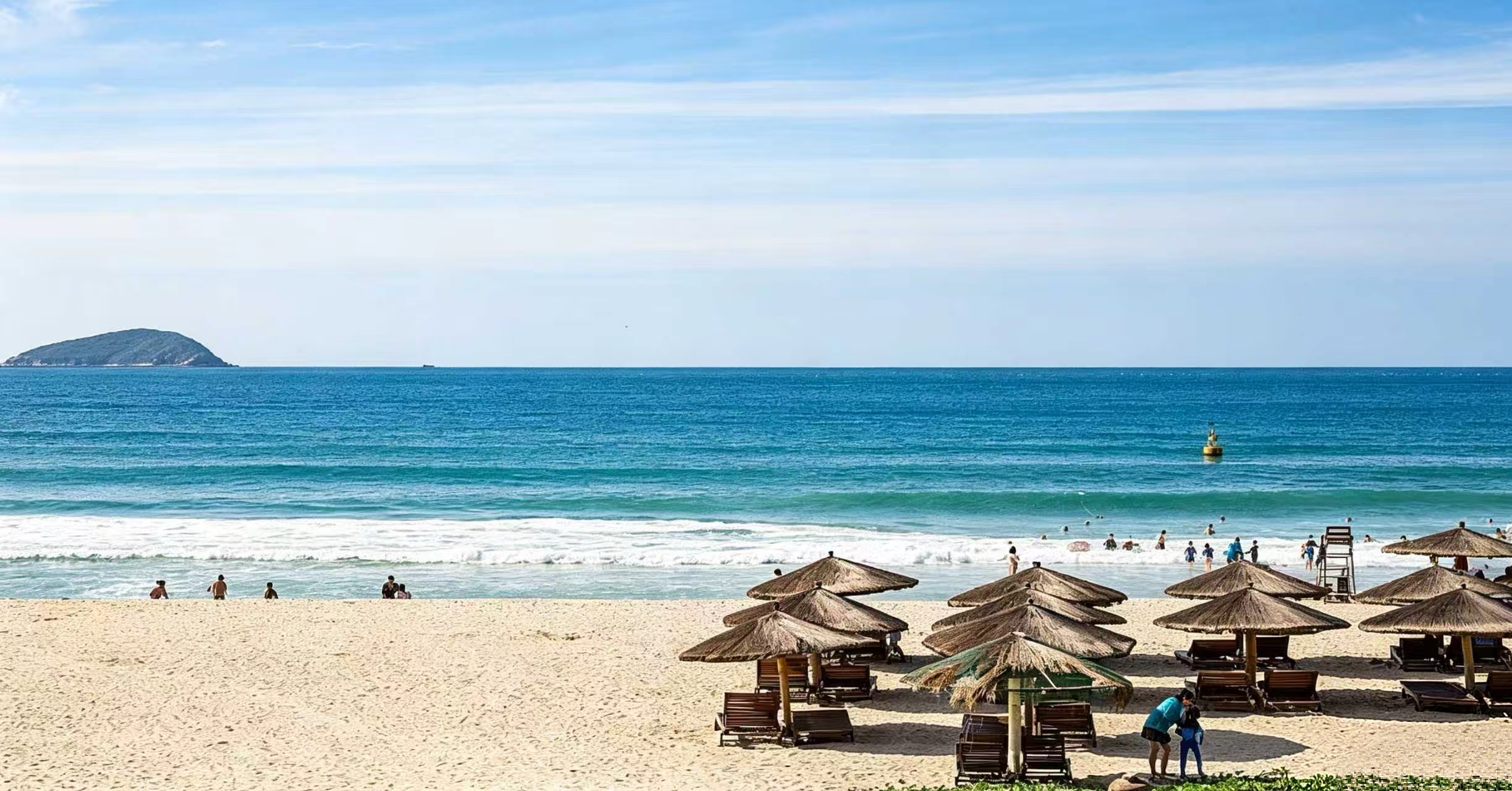Yalong Bay's white sand beach with turquoise water and palm trees, Sanya, Hainan